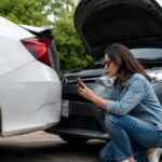 Woman documenting a rear-end car accident.