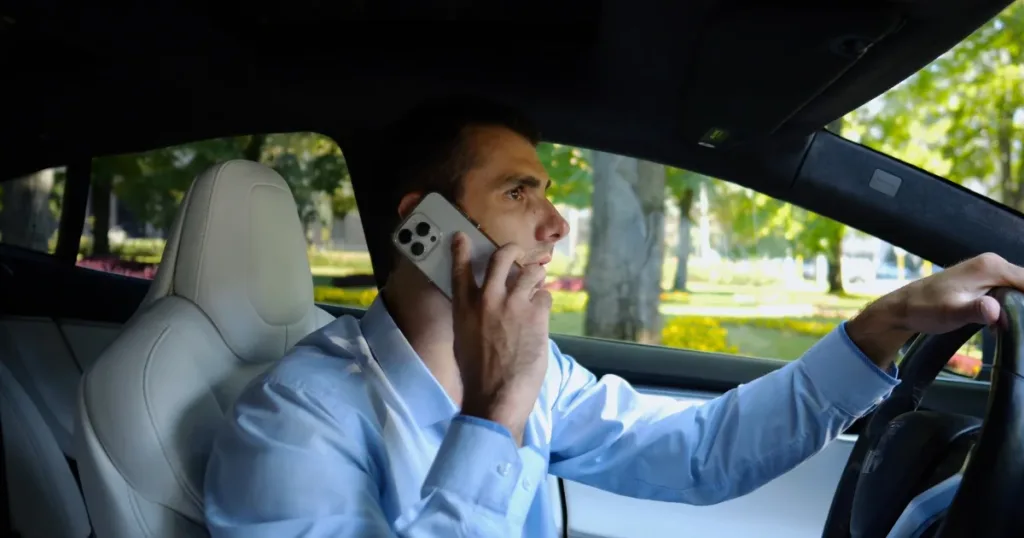 Man talking on phone while driving