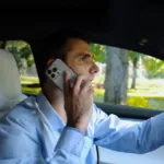 Man talking on phone while driving